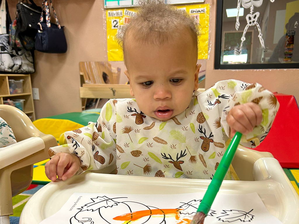 Children coloring indoors